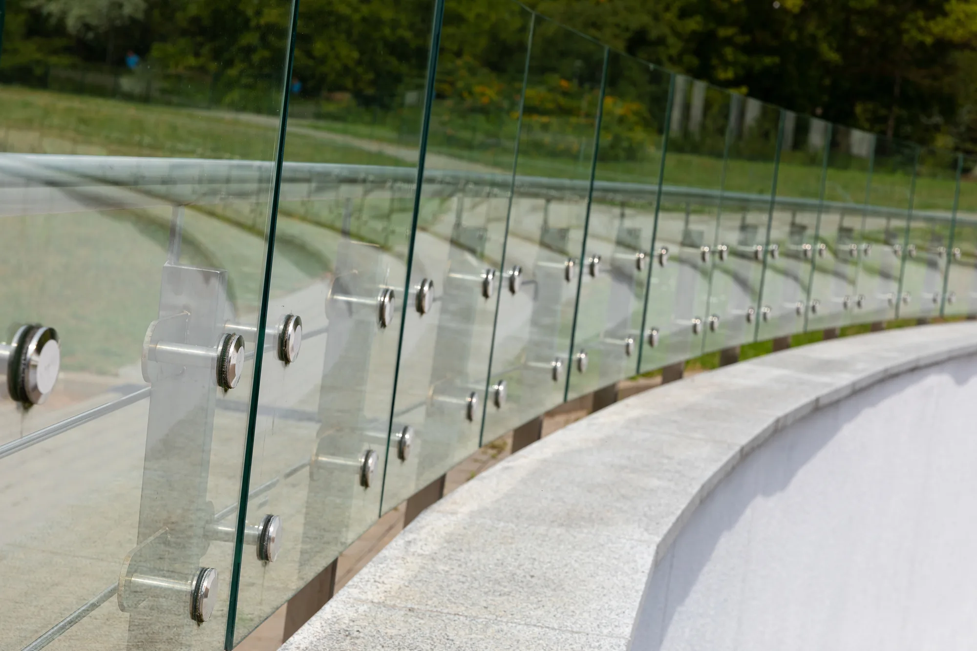 Curved glass balustrade on a public walkway