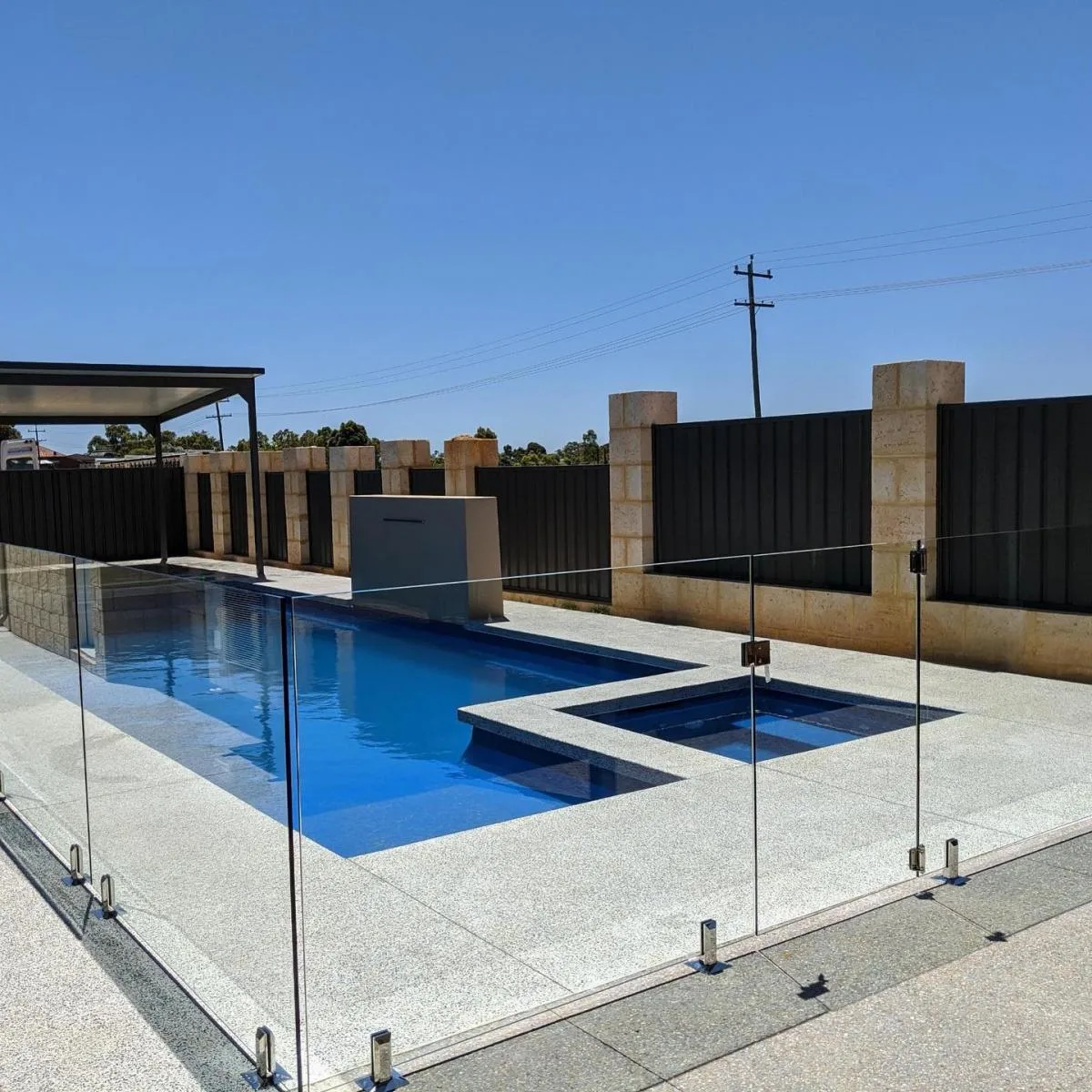 Frameless glass pool fencing around a plunge pool
