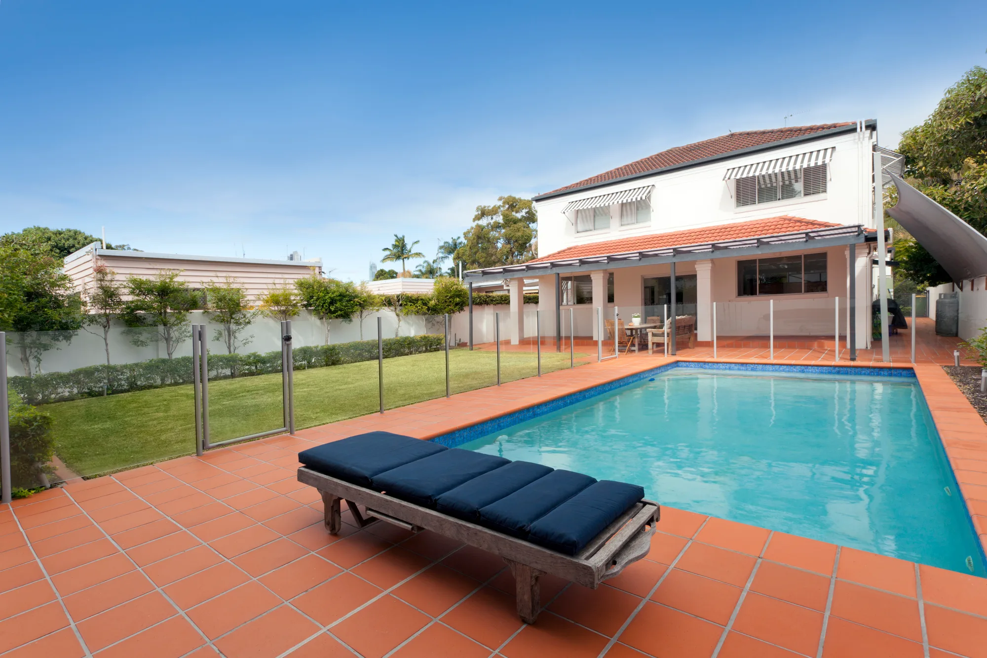 Glass pool fencing panels around a deck